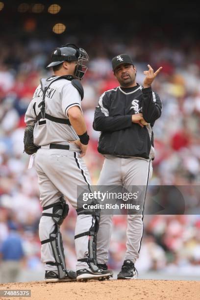 Ozzie Guillen, manager of the Chicago White Sox talks with catcher A. J. Pierzynski during the game against the Philadelphia Phillies at Citizens...