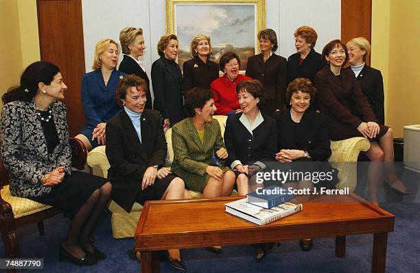 All 14 women senators -- a record number -- pose during a photo opp of a "power coffee" hosted by Senators Barbara Mikulski, D-Md., and Kay Bailey...
