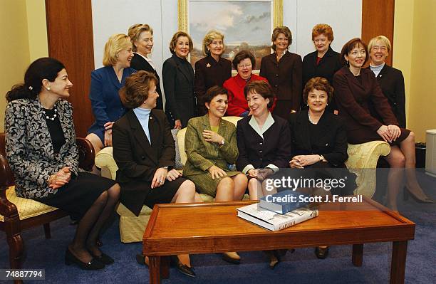 All 14 women senators -- a record number -- pose during a photo opp of a "power coffee" hosted by Senators Barbara Mikulski, D-Md., and Kay Bailey...