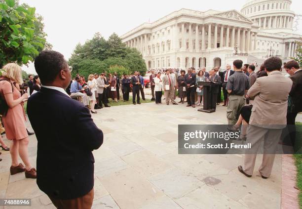 Luis V. Gutierrez, D-Ill., speaking, and members of the Congressional Black Caucus and the Hispanic Caucus during a relatively sparsely attended news...