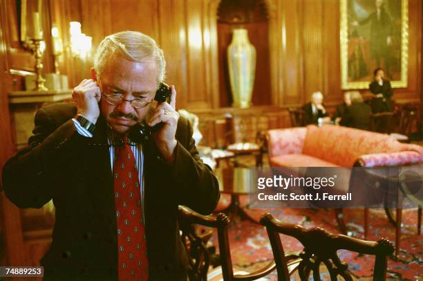 Bob Barr, R-Ga., talks on the phone in the Rayburn Room just off the House floor after an amendment vote.