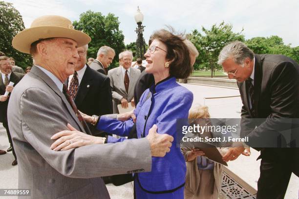 Sen. Strom Thurmond, R-S.C., and Tillie Fowler, R-Fla., greet each other as they arrive at the missile defense bill enrollment ceremony on the West...