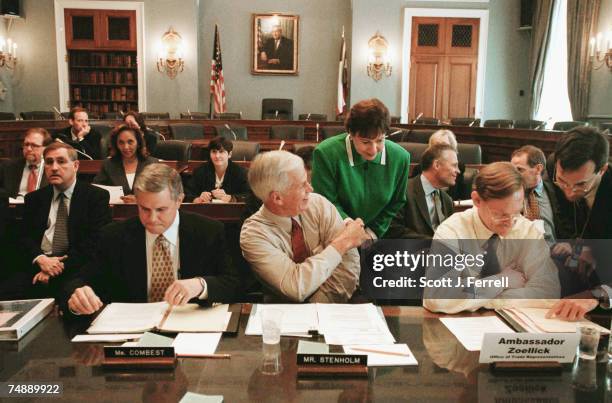 House Agriculture Chairman Larry Combest, R-Texas, left, and ranking Democrat Charles W. Stenholm, D-Texas, middle, prepare for a briefing with...