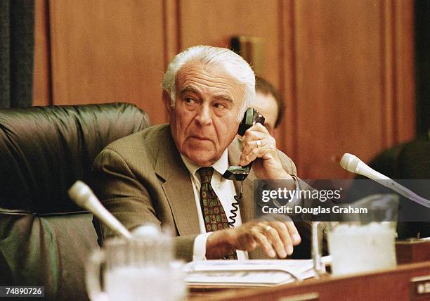 Chairman Benjamin A. Gilman, R-N.Y., makes a phone call before the start of the hearing on the Balkans Policy.