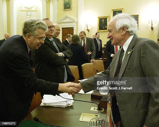 Robert C. Pozen, chairman of MFS Investment Management, and Rep. Sander M. Levin, D-Mich., shake hands before the Ways and Means hearing on social...