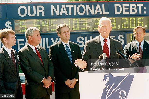 Sen. Ernest F. Hollings, D-S.C., speaks at a news conference sponsored by the Concord Coalition highlighting the growing national debt. With him are...