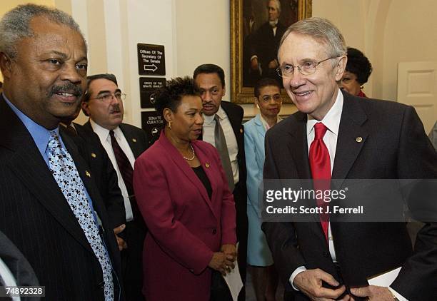 Before a news conference, Senate Minority Leader Harry Reid, D-Nev., far right, with members of the Congressional Black Caucus after CBC members...