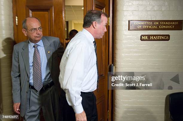 Chairman Doc Hastings, R-Wash., emerges with aide Ed Cassidy after House Speaker J. Dennis Hastert testified Tuesday for more than two and half hours...