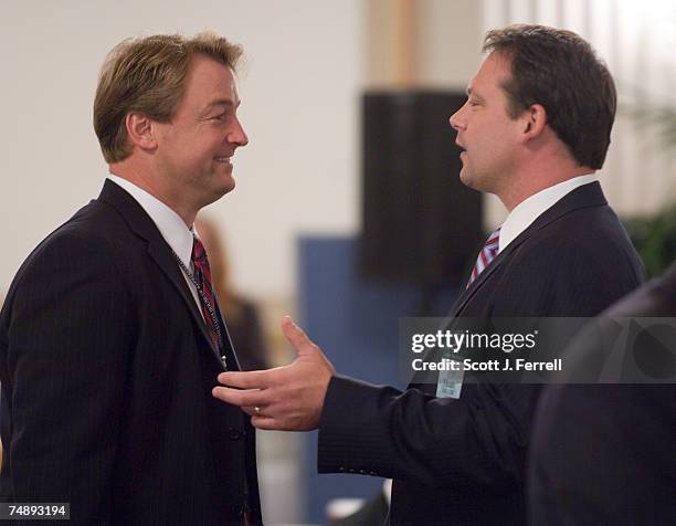 Rep.-Elect Dean Heller , and Rep.-Elect Heath Shuler , talk at the start of the House Administration orientation session for freshmen members of the...