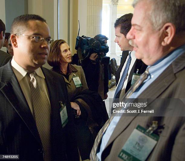 Foreground, Rep.-Elect Keith Ellison , and Rep.-Elect Phil Hare , and background, Rep.-Elect Kathy Castor , and Rep.-Elect Bruce Braley at the start...