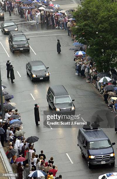 The hearse containing the coffin of former President Ronald Reagan makes its way along 22nd Street N.W. On the way to the National Cathedral, where a...