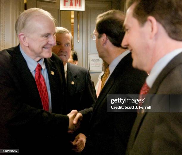 Sam Johnson, R-Texas, E. Clay Shaw Jr., R-Fla., and Senators John E. Sununu, R-N.H., and Jim DeMint, R-S.C., arrive for a news conference announcing...