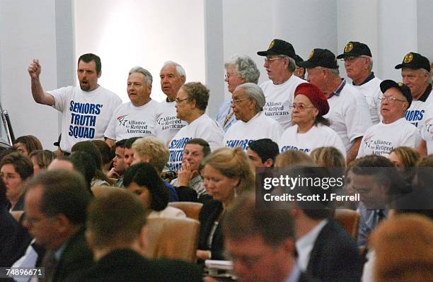 Protesters inturrupt Chairman Bill Thomas' opening statement, shouting, "We're blowing the whistle! Don't privatize Medicare!" during the markup of...