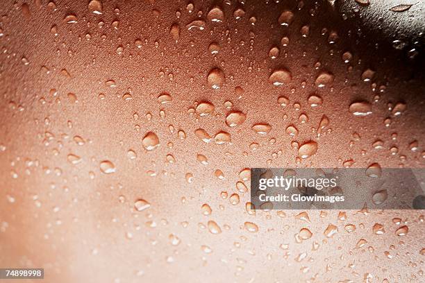 close-up of water drops on a human body - human skin back stock pictures, royalty-free photos & images