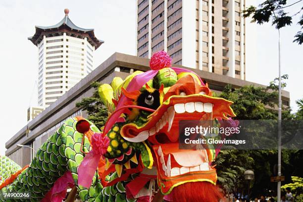 close-up of a chinese dragon in a chingay festival, singapore - chingay parade stock pictures, royalty-free photos & images