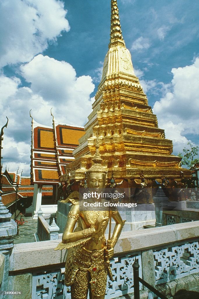 Statue in front of a temple, Wat Phra Kaeo, Grand Palace, Bangkok, Thailand