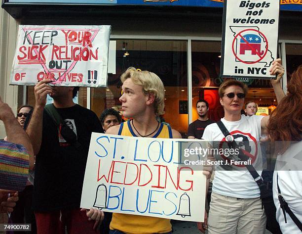 Jake Schabacker of New York City, Daniel Boyer, of Joplin, Mo., and Julie Delaurier of New York City during a protest at the Westin Hotel of the...