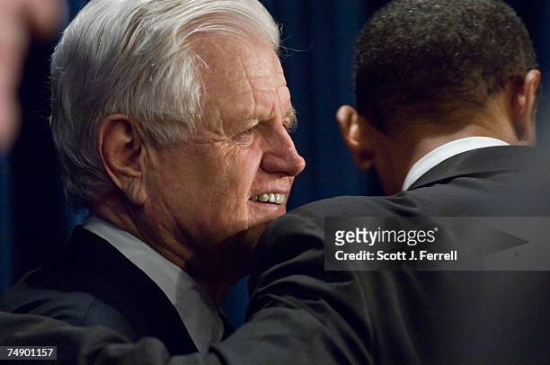 Sen. Barack Obama, D-Ill., right, hugs Sen. Edward M. Kennedy, D-Mass., during a news conference after the Senate capped a two-week debate by passing...