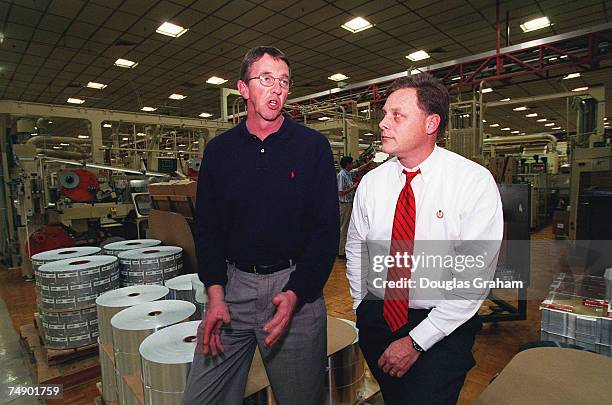 Joe Inman Vice President Manufacturing of RJ Reynolds tobacco company and Richard M. Burr,R-N.C., talk about the tobacco industry during a plant tour...