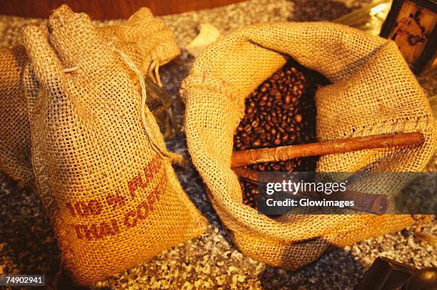 high angle view of coffee beans in burlap sacks, bangkok, thailand - tela ruvida foto e immagini stock