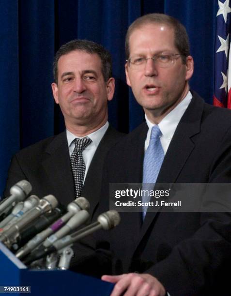 Sen. Russell D. Feingold, D-Wis., smiles as he listens to Sen. John E. Sununu, R-N.H., during a news conference after nearly-unanimous Senate...