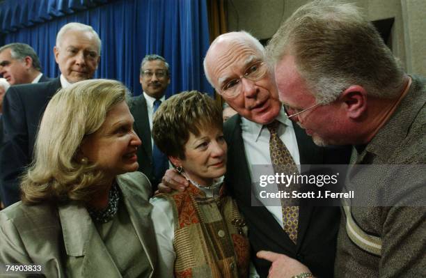 Debbie Smith, a domestic violence advocate and sexual assault survivor, third from left, and Kirk Bloodsworth, whose case was the first capital...