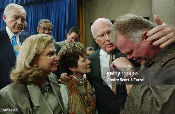 Debbie Smith, a comestic violence advocate and sexual assault survivor, and Kirk Bloodsworth, wiping tears, whose case was the first capital...