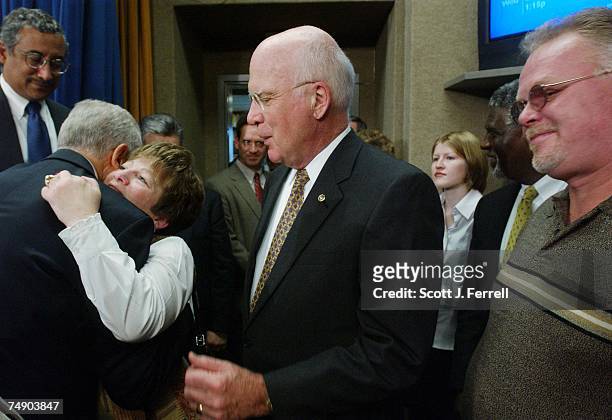 Senate Judiciary Chairman Orrin G. Hatch, R-Utah, embraces Debbie Smith, a domestic violence advocate and sexual assault survivor, after a news...
