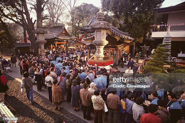 high angle view of a large group of people celebrating setsubun festival, tokyo prefecture, japan - shrine stock pictures, royalty-free photos & images