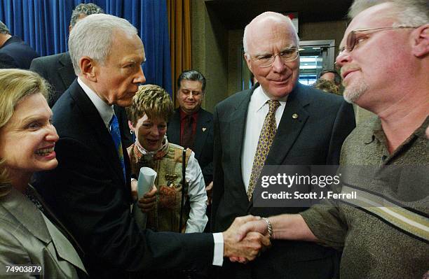 Senate Judiciary Chairman Orrin G. Hatch, R-Utah, shakes hands with Kirk Bloodsworth, whose case was the first capital conviction to be overturned by...