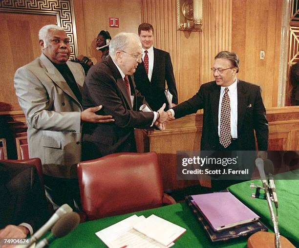 Sen. Foreign Relations Chairman Jesse Helms, R-N.C., and Anwarul Karim Chowdhury, ambassador the the United Nations from Bangladesh, greet each other...