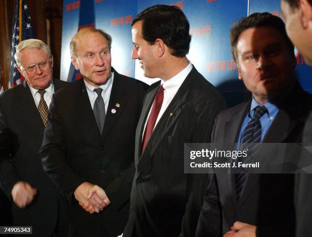 Rep. Joe Pitts, R-Pa., Rep. Steve Chabot, R-Ohio, Sen. Rick Santorum, R-Pa., and Rep. Christopher H. Smith, R-N.J., congratulate each other after a...