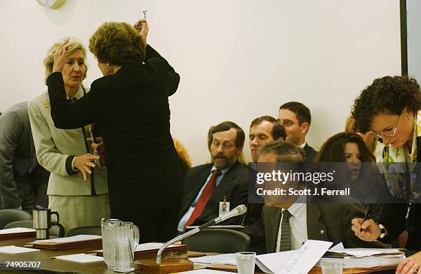 Sen. Kay Bailey Hutchison, R-Texas, and Sen. Dianne Feinstein, D-Calif., consult as Senate Appropriations Chairman Ted Stevens, R-Alaska, confers...