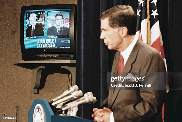 Broadcasts in the background as Senate Armed Services member Charles Robb, D-Va., speaks during a news conference in the Senate Radio/TV Gallery...