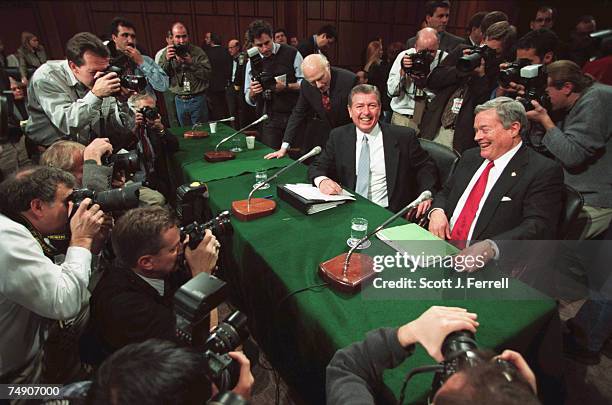 Sen. Herb Kohl, D-Wis., John Ashcroft, nominee for U.S. Attorney General, and Sen. Christopher S. Bond, R-Mo., are surrounded