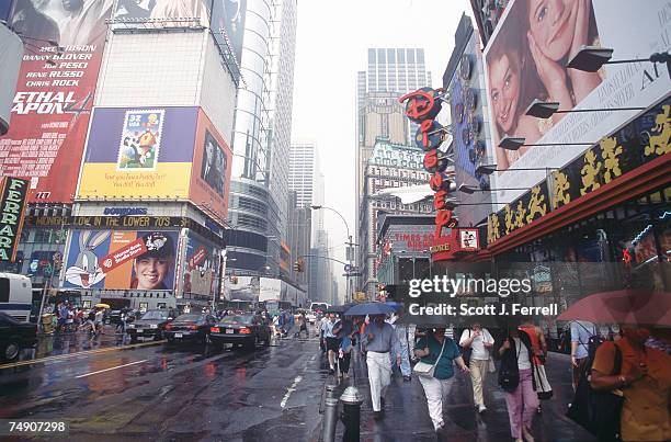 The Disney Store, right, and Warner Bros. Studio Store, left, compete for attention in New York City's Times Square.