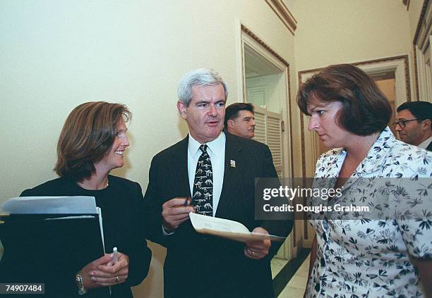 Speaker of the House Newt Gingrich,R-Ga., talks with Lisa Nelson,director of Public Affiars and Christina Martin,Press Secretary, before his speech...