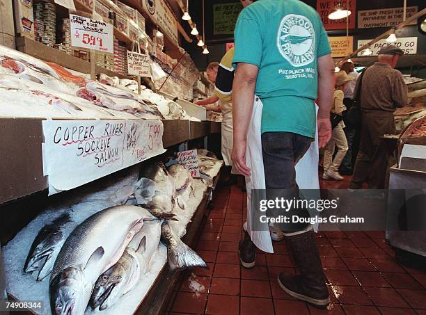 Seafood hawker's work the crowd at Purefood Fish Market.Pike Place Market is a open-air market in downtown Seattle.