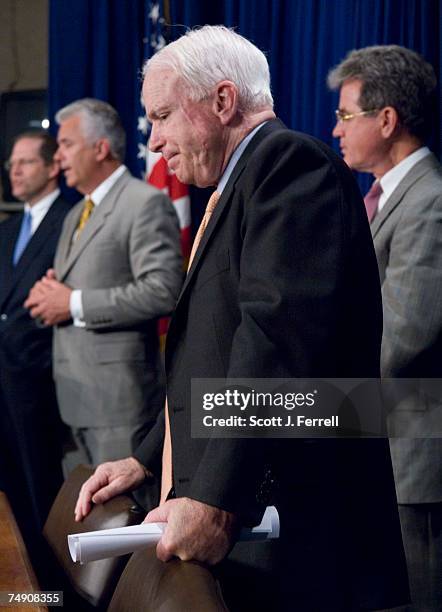 Sen. John E. Sununu, R-N.H., Sen. John Ensign, R-Nev., Sen. John McCain, R-Ariz., and Sen. Tom Coburn, R-Okla., during a news conference on the...