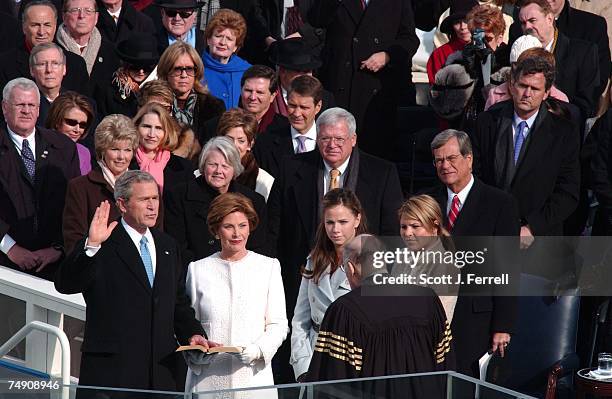 President George W. Bush is sworn in for his second term by Supreme Court Chief Justice William H. Rehnquist. With President Bush are First Lady...