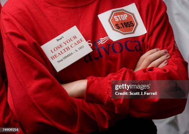 Sen. Richard J. Durbin, D-Ill., far left, and Sen. Edward M. Kennedy, D-Mass., during a rally at the U.S. Capitol against legislation, sponsored by...