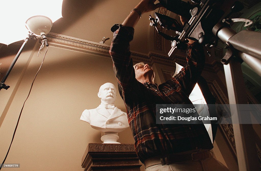 RECESS--Photographer Charles H. Phillps sets up his 4x5 view
