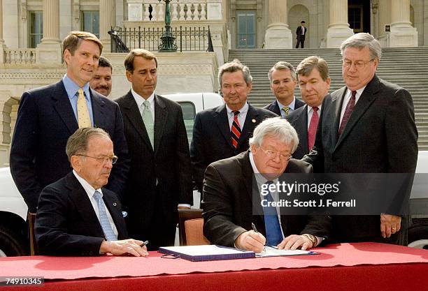 Sen. Ted Stevens, R-Alaska, who is the Senate's President Pro Tempore, and House Speaker J. Dennis Hastert, R-Ill., sign a $70 billion tax cut...