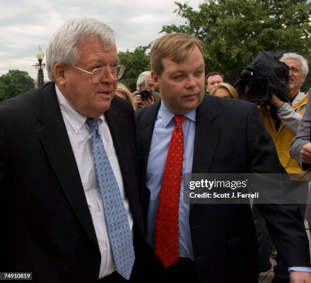 Spokesman Ron Bonjean leads House Speaker J. Dennis Hastert, R-Ill., through a group of media to his place during a rally on the West Front of the...