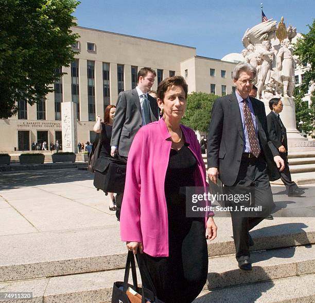 House of Representatives General Counsel Geraldine Gennet, in purple, exits E. Barrett Prettyman U.S. Courthouse after presenting arguments to Chief...