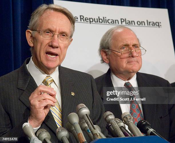 Senate Minority Leader Harry Reid, D-Nev., and Sen. Carl Levin, D-Mich., during a news conference on troop withdrawal from Iraq. Behind them is a...