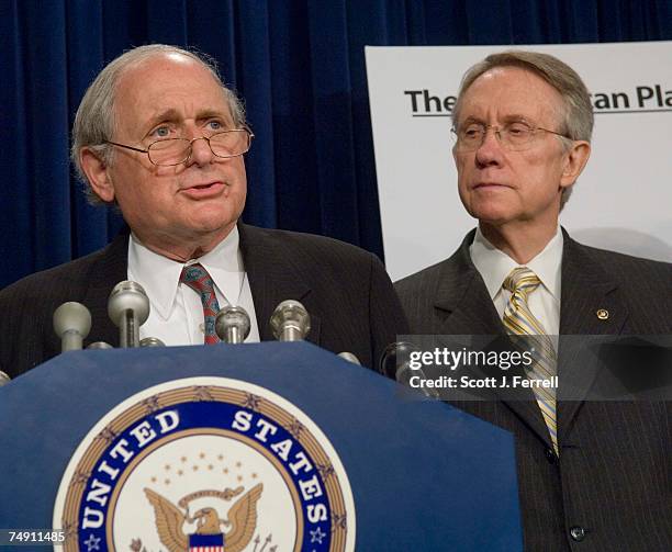 Sen. Carl Levin, D-Mich., and Senate Minority Leader Harry Reid, D-Nev., during a news conference on troop withdrawal from Iraq. Behind them is a...