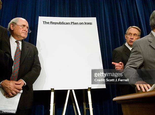 Sen. Carl Levin, D-Mich., and Senate Minority Leader Harry Reid, D-Nev., during a news conference on troop withdrawal from Iraq. Behind them is a...