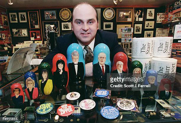 Thane Fake, manager of "Political Americana", a shop in Union Station, with nesting dolls of Clinton scandal personalities made by Treasures from...