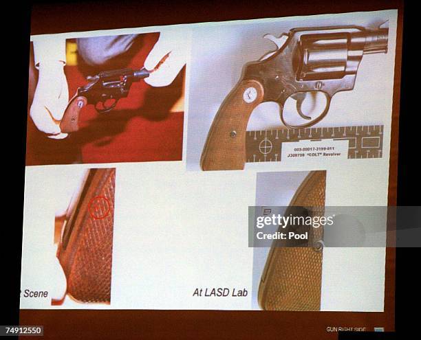 Photos are projected on display of the details of a .38 Colt Cobra gun identified as the weapon used in the shooting death of actress Lana Clarkson...